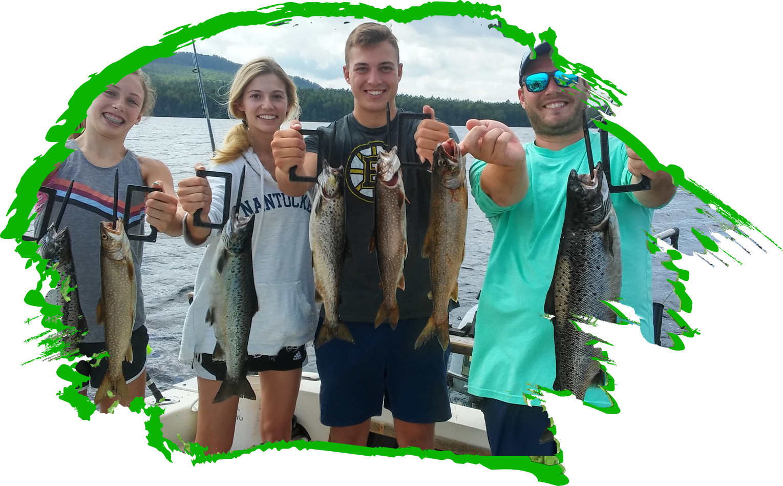 four people holding up fish on a boat.